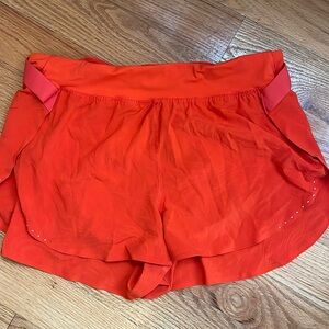 Orange / red lululemon split shorts with inseam underwear and belt for shirt